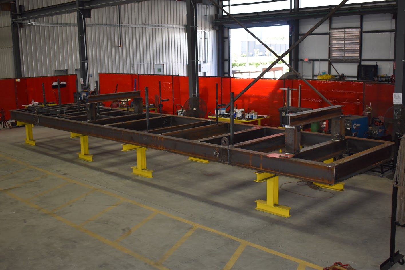 Steel beams being manufactured in the warehouse